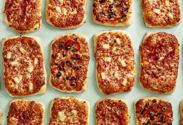 Multiple pizzas on a table